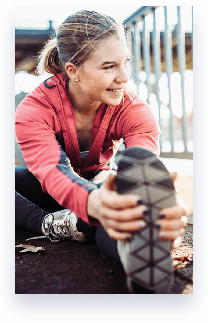 woman stretching before running