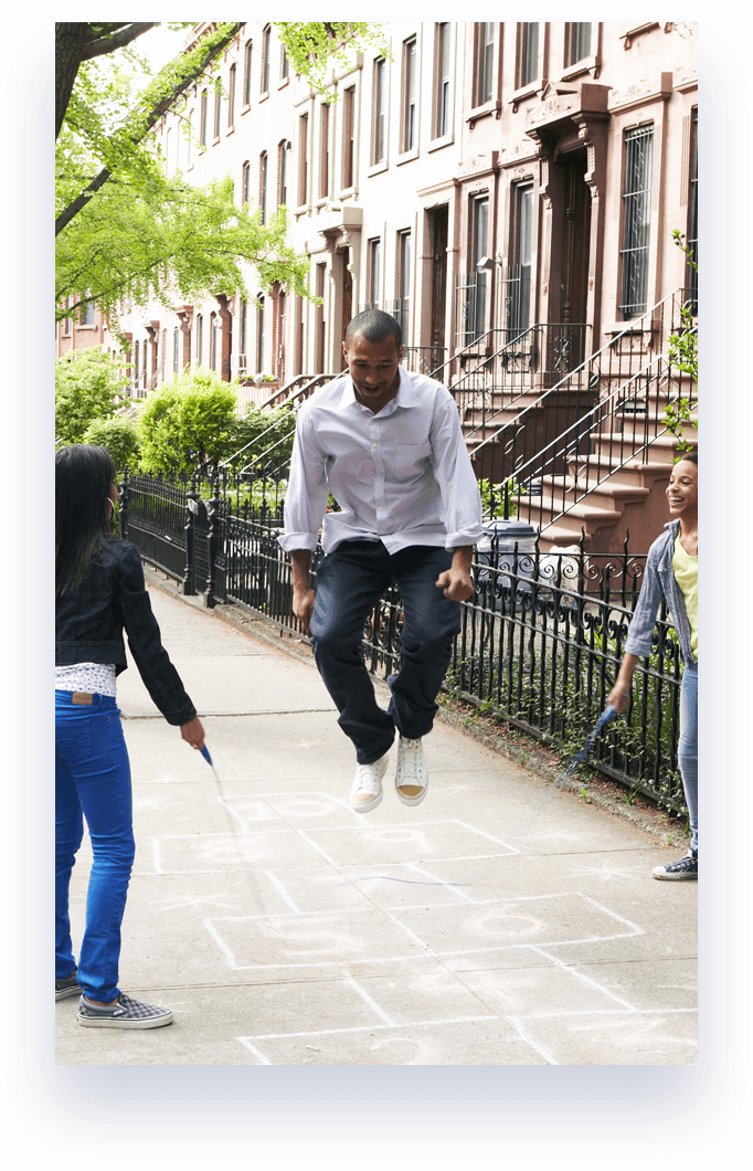 three people playing jump rope